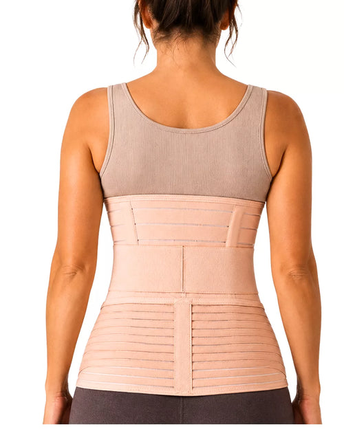 A woman wearing a beige postpartum recovery belt on a white background.